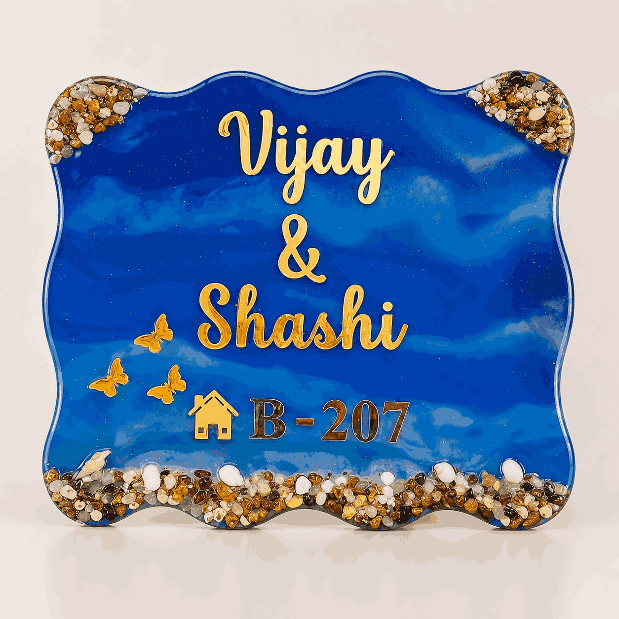 Royal Blue Pebble Resin Name Plate with personalized gold names, decorative stones and house number