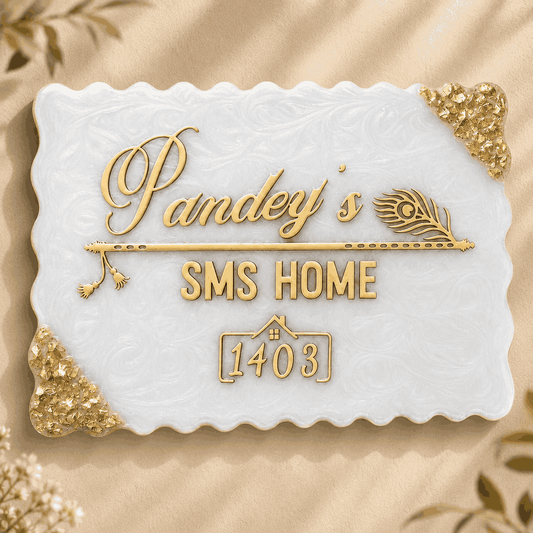 White pearl resin name plate with gold name details and decorative corner accents on a soft beige background